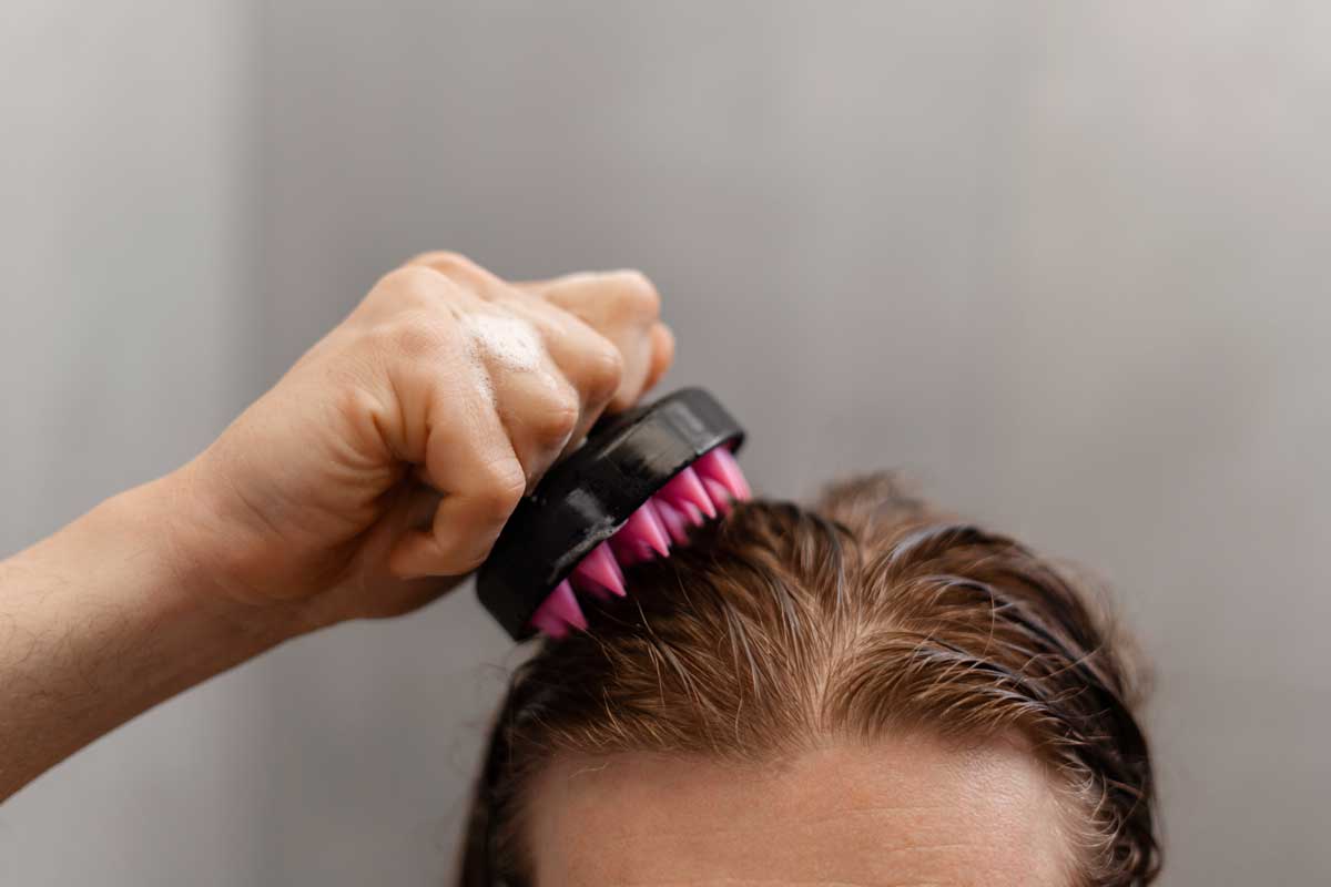 man-giving-himself-scalp-massage